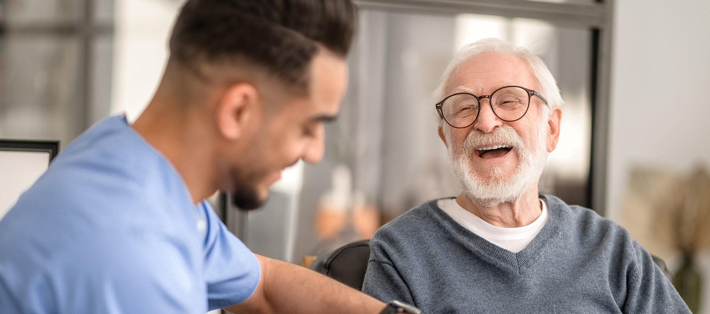 Patient having his hand massaged with a spiky massage ball