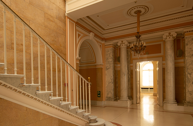 Corridor with staircases and a grand chandelier at the former U.S. Consulate General in Hamburg
