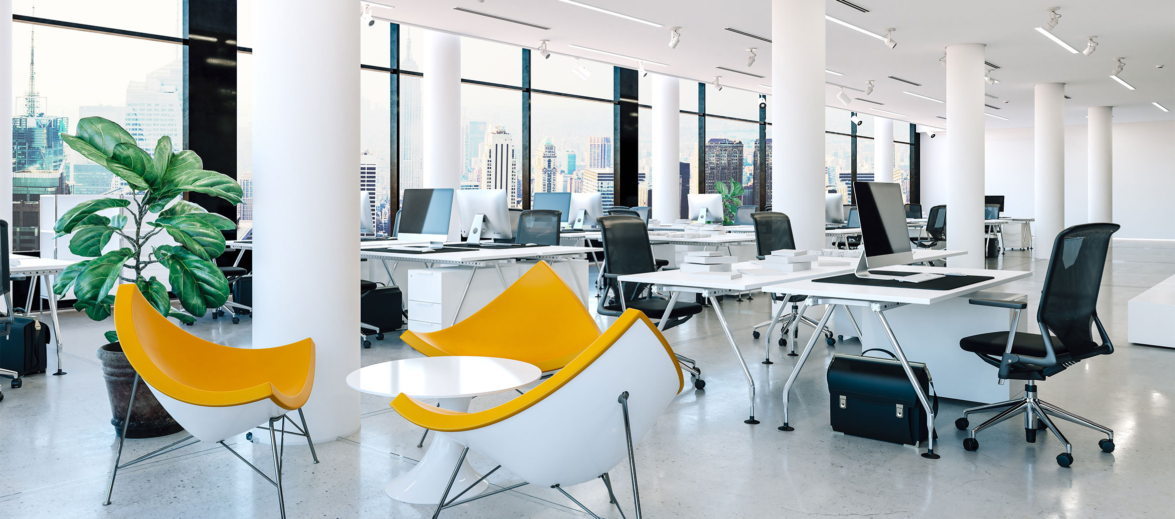 Modern clean office space with yellow chairs and plants