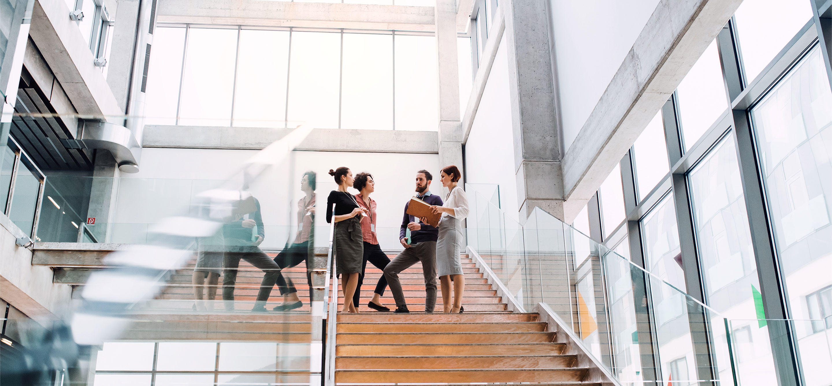 Office  - People standing on a staircase, talking