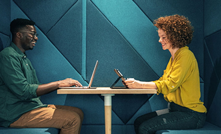colleagues working on laptops
