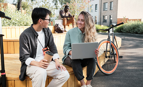 two people talking on a bench